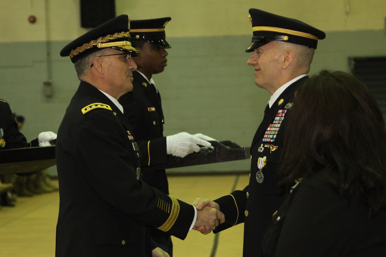 Outgoing United States Forces Korea Command Sergeant Major John Troxell shakes hands with Gen. Curtis M. Scaparrotti during Troxell's Change of Responsibility Ceremony. Troxell was selected to become the 20th Senior Enlisted Advisor to the Chief of Staff. (U.S. Army photo by Cpl. Choi, Woo-hyuk)