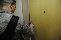 8th Civil Engineering Squadron Unaccompanied Housing Airman sets up a key code in building 535 at Kunsan Air Base, Republic of Korea, Dec. 2, 2015. The dormitory buildings are being changed to smart locks as part of a three phase program to reduce dormitory lockouts.