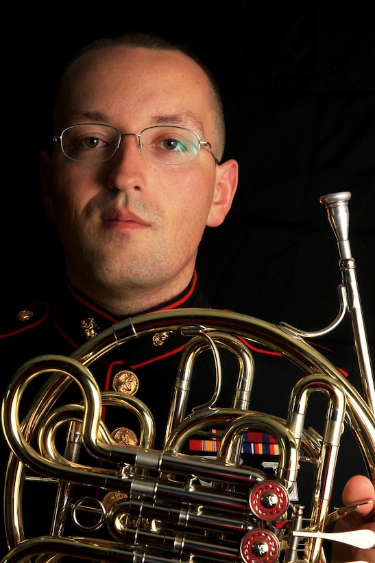 Cpl. Aaron Atwood poses for a photograph holding his French Horn Nov. 5, at Marine Recruiting Station Springfield’s Headquarters. The 27-year-old Danbury, Connecticut-native used his Post 9/11 G.I. Bill to obtain a Bachelor’s of Music Performance Classical French Horn from Western Connecticut State University. Atwood has reenlisted into the Marines so that he can have a career as a full time preforming musician. He will be with the Marine Band stationed in New Orleans, La. (Official Marine Corps photo by Staff Sgt. Richard Blumenstein).