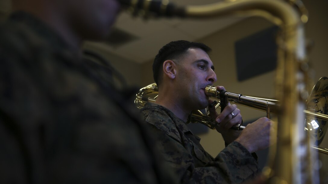 Staff Sgt. Alexander Panos, a trombone player with the 1st Marine Division Band, rehearses alongside his fellow Marines aboard Marine Corps Base Camp Pendleton, Nov. 23, 2015. Panos was recognized as the Marine Corps Musician of the Year Award for 2015