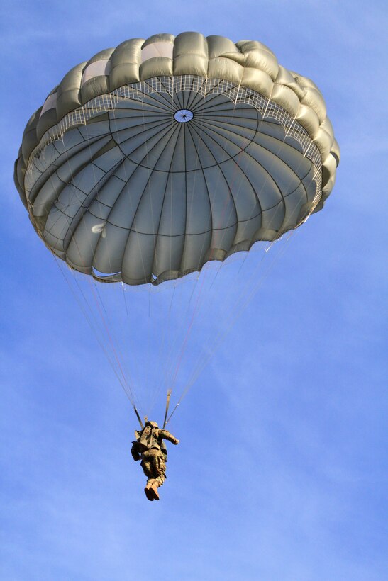 A paratrooper prepares to land on St. Mere-Eglise drop zone during airborne operations on Fort Bragg, N.C., Nov. 25, 2015. U.S. Army photo by Spc. Kevin A. Kim