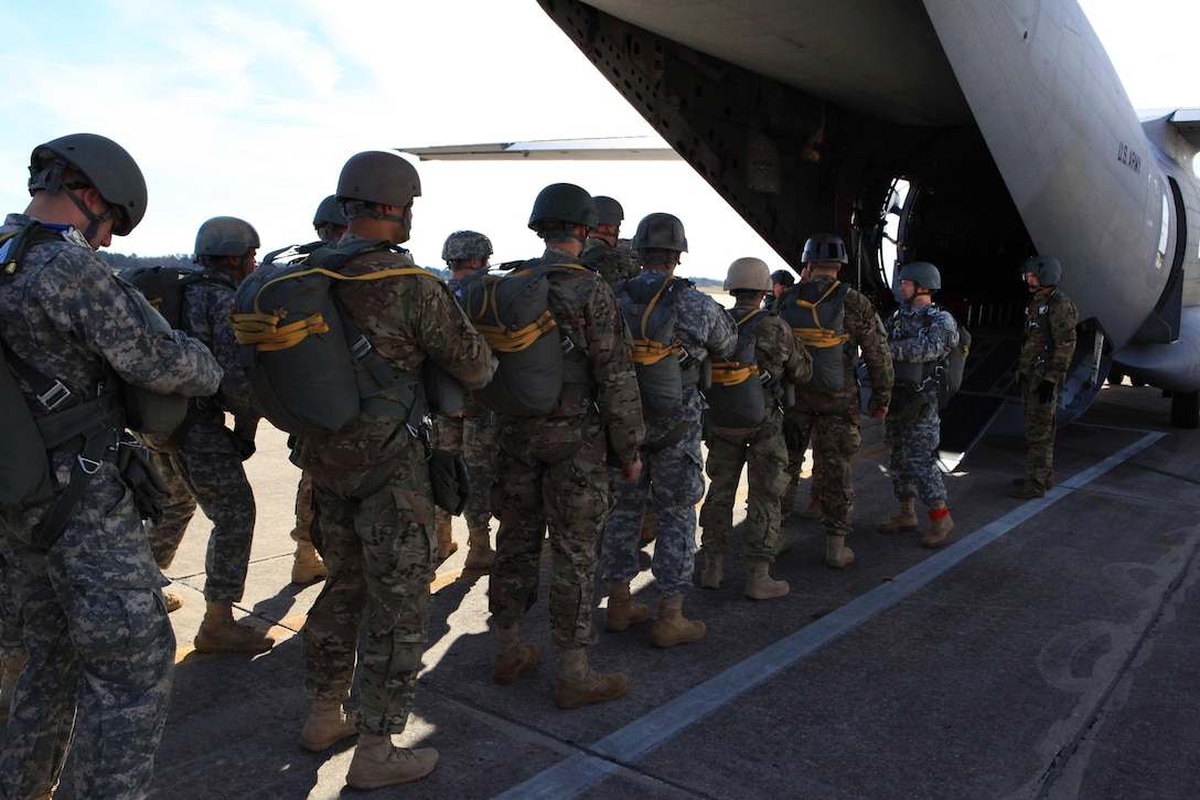 Paratroopers load onto a C-27 Spartan aircraft before conducting airborne operations over St. Mere-Eglise drop zone on Fort Bragg, N.C., Nov. 25, 2015. U.S. Army photo by Sgt. 1st Class Sean A. Foley