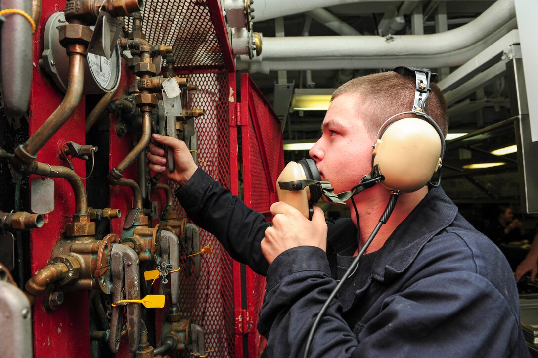 U.S. Navy Gunner's Mate Seaman Tyler Cramer operates a weapons magazine sprinkler system remotely from the mess decks of the aircraft carrier USS Dwight D. Eisenhower in the Atlantic Ocean, Nov. 25, 2015. U.S. Navy photo by Petty Officer 3rd Class Taylor L. Jackson