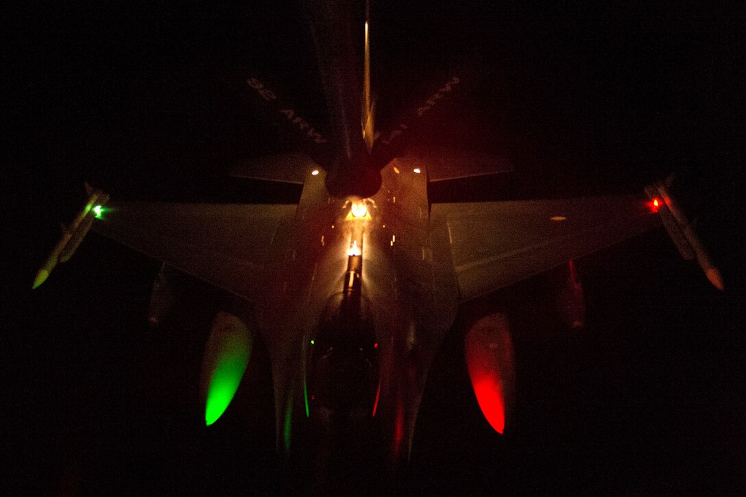 An U.S. Air Force KC-135 Stratotanker aircraft refuels F-16 aircraft in support of Operation Inherent Resolve over Southwest Asia, Dec.1, 2015. U.S. Air Force photo by Tech. Sgt. Nathan Lipscomb