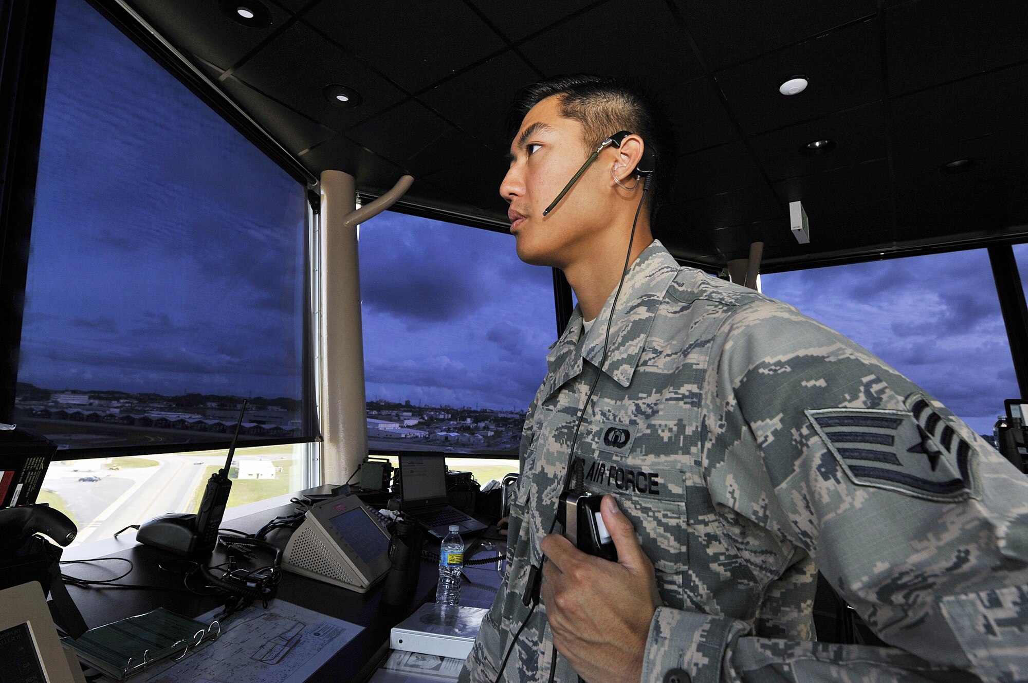 U.S. Air Force Staff Sgt. Jesse Kow, 18th Operations Support Squadron air traffic controller, advises an F-16 Fighting Falcon pilot before takeoff, Nov. 30, 2015, at Kadena Air Base, Japan. Kadena is the largest combat wing in the Pacific with its abundance of air frames and missions. Kadena's air traffic controllers are responsible for providing air traffic control and operations at one of the busiest airfields in the Air Force. (U.S. Air Force photo by Naoto Anazawa/Released)