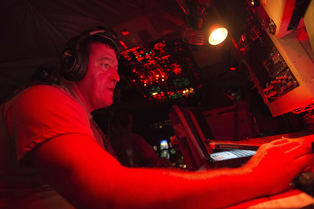 U.S. Air Force Tech. Sgt. James Marier works inside the flightdeck of a KC-135 Stratotanker refueling aircraft in support of Operation Inherent Resolve over Southwest Asia, Dec.1, 2015. Marier is a boom operator assigned to the 340th Expeditionary Air Refueling Squadron. U.S. Air Force photo by Tech. Sgt. Nathan Lipscomb