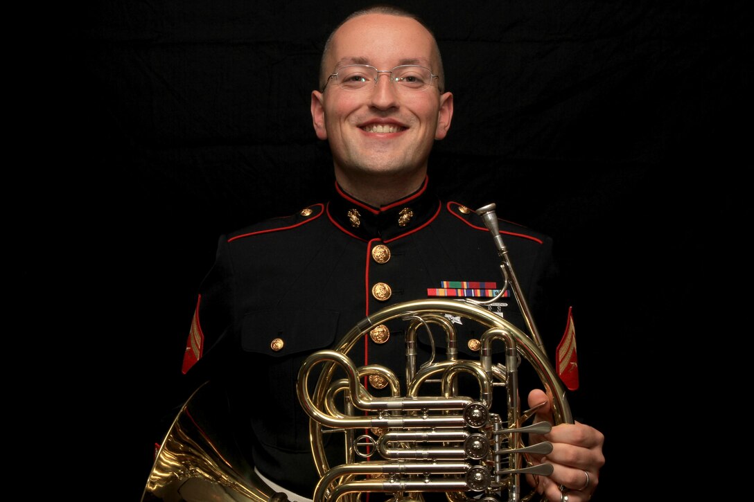 Cpl. Aaron Atwood poses for a photograph holding his French Horn Nov. 5, at Marine Recruiting Station Springfield’s Headquarters. The 27-year-old Danbury, Conn.-native used his Post 9/11 G.I. Bill to obtain a Bachelor’s of Music Performance Classical French Horn from Western Connecticut State University. Atwood has reenlisted into the Marines so that he can have a career as a full time preforming musician. He will be with the Marine Band stationed in New Orleans, La.