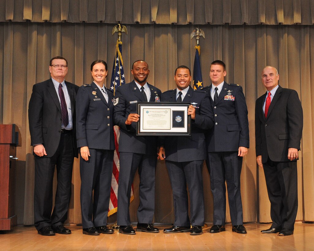 The Defense Department's Chief Information Officer Terry Halvorsen, left, poses with members of the Air Force Information Network Mission Assurance Center Development Team, which won a team award at the 2015 Department of Defense Chief Information Officer Award for Cyber and IT Excellence at the
Pentagon, Washington, D.C., Dec. 1, 2015. U.S. Army photo by EboniEverson-Myart
