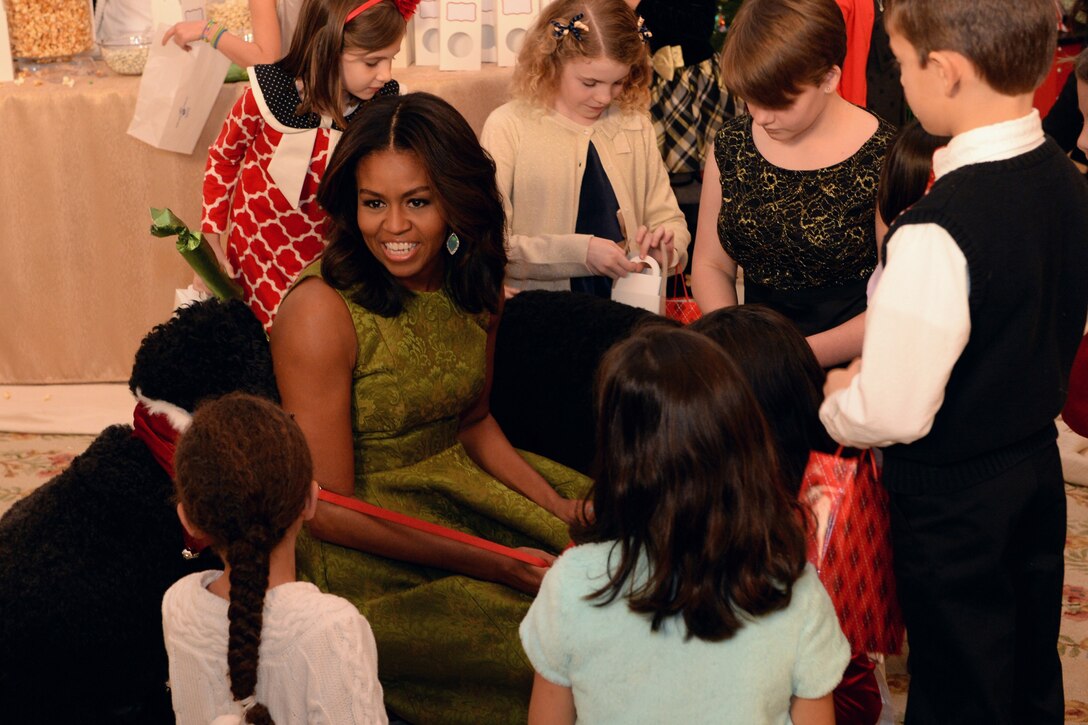 First Lady Michelle Obama talks with guests while hosting military family members at the White House to give them a look at 2015 holiday decorations and treat preparation, Dec. 2, 2015. DoD photo by EJ Hersom