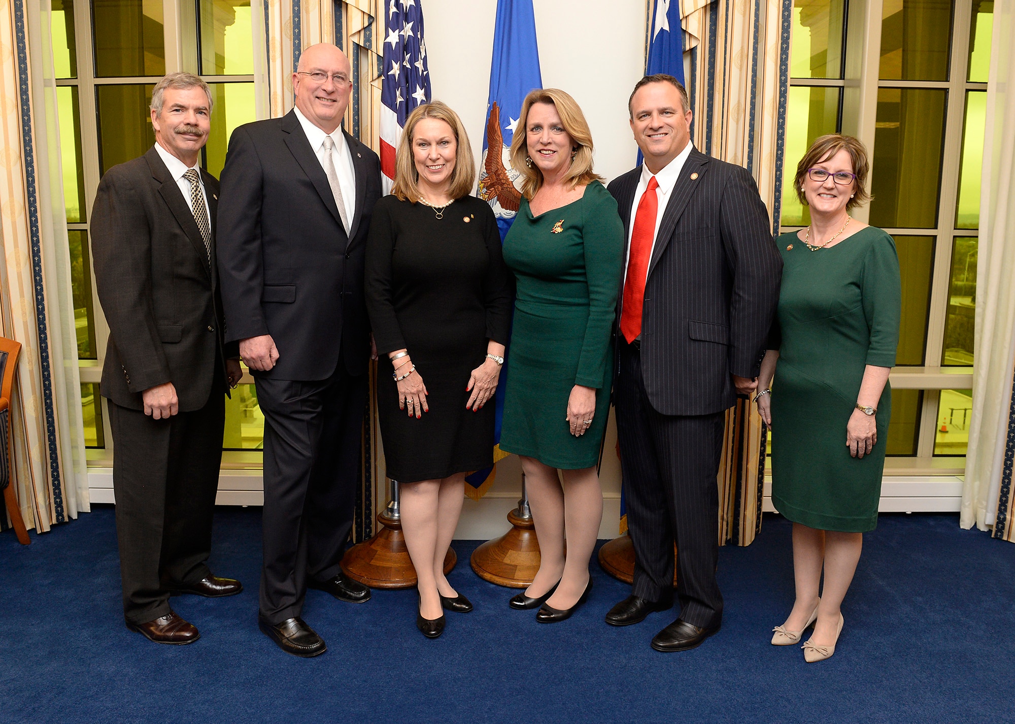 Secretary of the Air Force Deborah Lee James stands with, from left, John Wood, chairman of the TAPS board; David Coker, president of the Fisher House Foundation; Bonnie Carroll, founder of TAPS; Brian Gawe, vice president for Fisher House community relations; and TAPS member Ellen Andrews. (U.S. Air Force photo/Scott M. Ash)