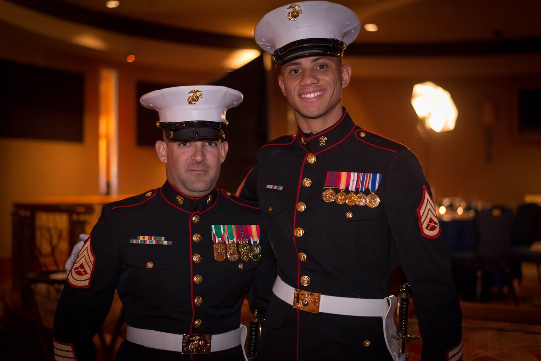 GySgt. Allen Lee (left) and SSgt. Joseph Ford, from the 12th Marine Corps District Supply Office, pose for pictures before performing in the sword detail at the 12th MCD’s ball ceremony in San Diego, Ca. Nov. 6 2015. The Marine Corps Ball celebrates the birth of the Marine Corps and is a unifying tradition held by Marine commands all over the world. (U.S. Marine Corps photo provided by SSgt. Joseph Ford)