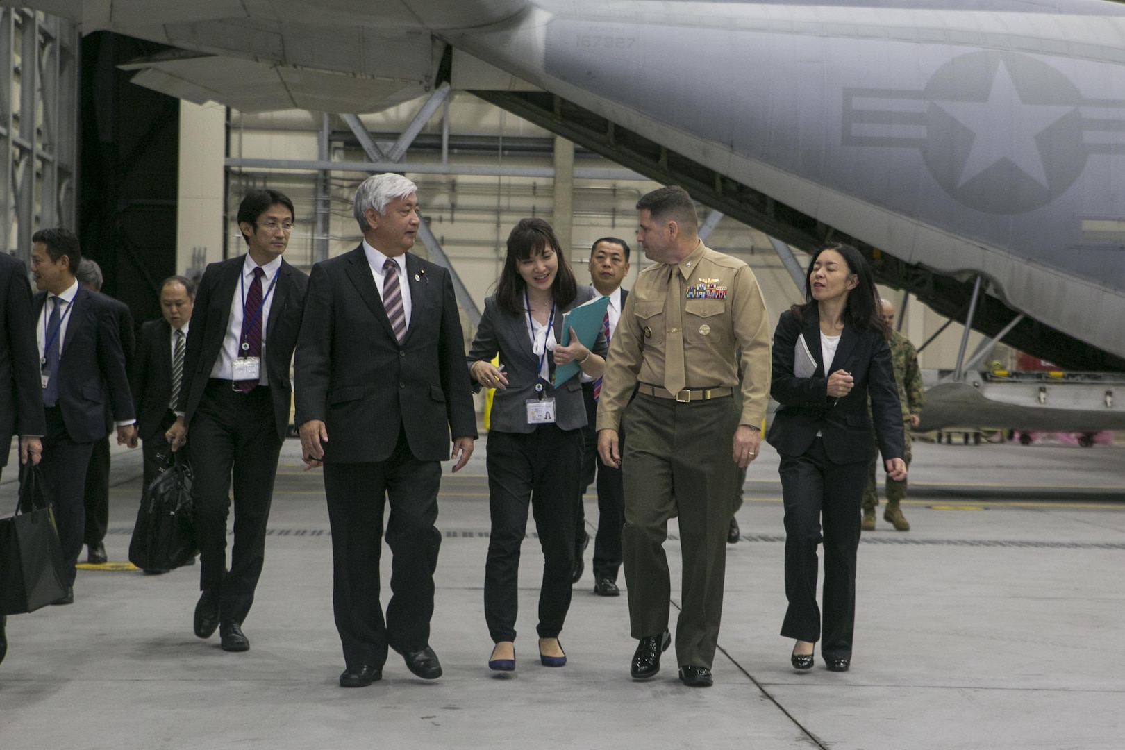 Gen Nakatani, Japanese Defense Minister, tours Marine Aerial Refueler Transport Squadron (VMGR) 152 facilities during his visit to Marine Corps Air Station Iwakuni, Japan, Dec. 2, 2015. Station officials welcomed Nakatani before touring VMGR-152 and the air traffic control tower. This visit built a stronger bilateral understanding between station personnel and Japanese officials. (U.S. Marine Corps photo by Cpl. Carlos Cruz Jr./Released)