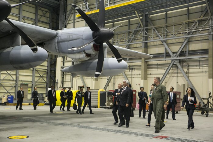 Gen Nakatani, Japanese Defense Minister, tours Marine Aerial Refueler Transport Squadron (VMGR) 152 facilities during his visit to Marine Corps Air Station Iwakuni, Japan, Dec. 2, 2015. Station officials welcomed Nakatani before touring VMGR-152 and the air traffic control tower. This visit built a stronger bilateral understanding between station personnel and Japanese officials. (U.S. Marine Corps photo by Cpl. Carlos Cruz Jr./Released)