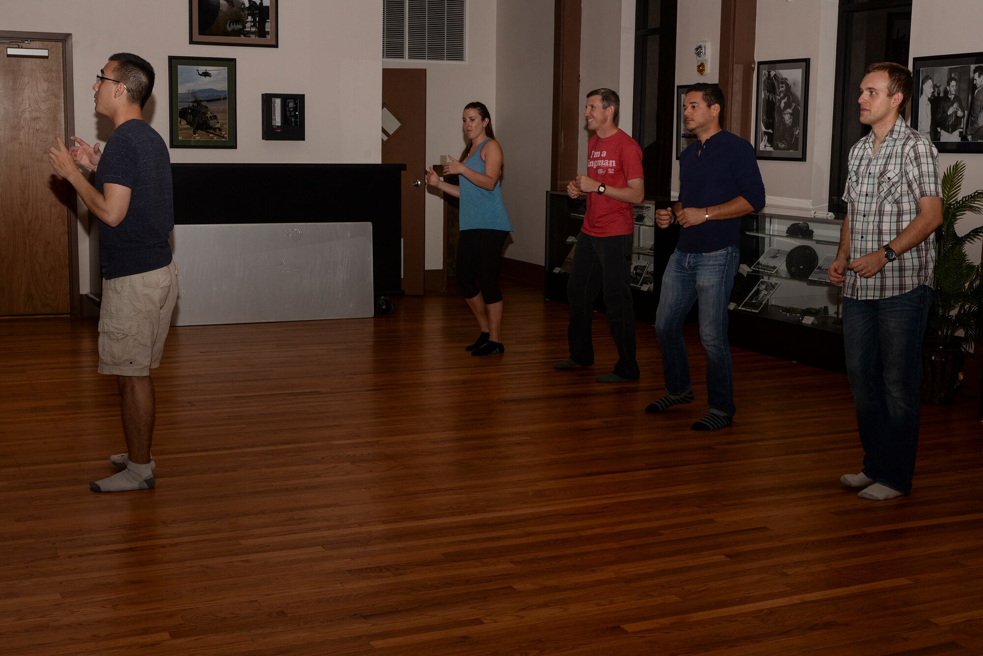 U.S. Air Force 2nd Lt. Simon Pena, 23d Force Support Squadron fitness and sports officer, explains how the “lead,” who is responsible for guiding partners while they dance, should move during a swing dance class, Nov. 12, 2015, at Moody Air Force Base, Ga. Pena taught swing dance classes for three years throughout college and encourages beginners in the class to have fun. (U.S. Air Force photo by Airman 1st Class Janiqua P. Robinson/Released)