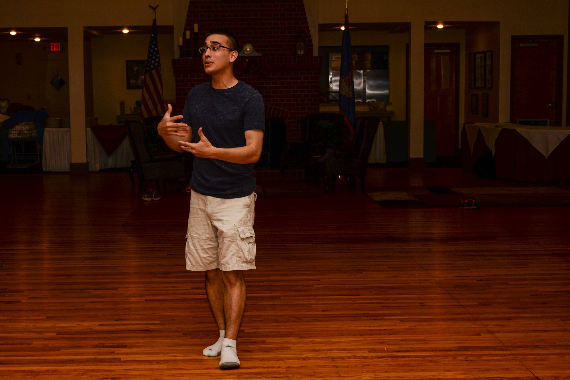 U.S. Air Force 2nd Lt. Simon Pena, 23d Force Support Squadron fitness and sports officer, introduces concepts and terminology associated with East Coast Swing during a dance class, Nov. 12, 2015, at Moody Air Force Base, Ga. The free class was held at the Heritage Hall and broke down the basics of East Coast Swing. (U.S. Air Force photo by Airman 1st Class Janiqua P. Robinson/Released)