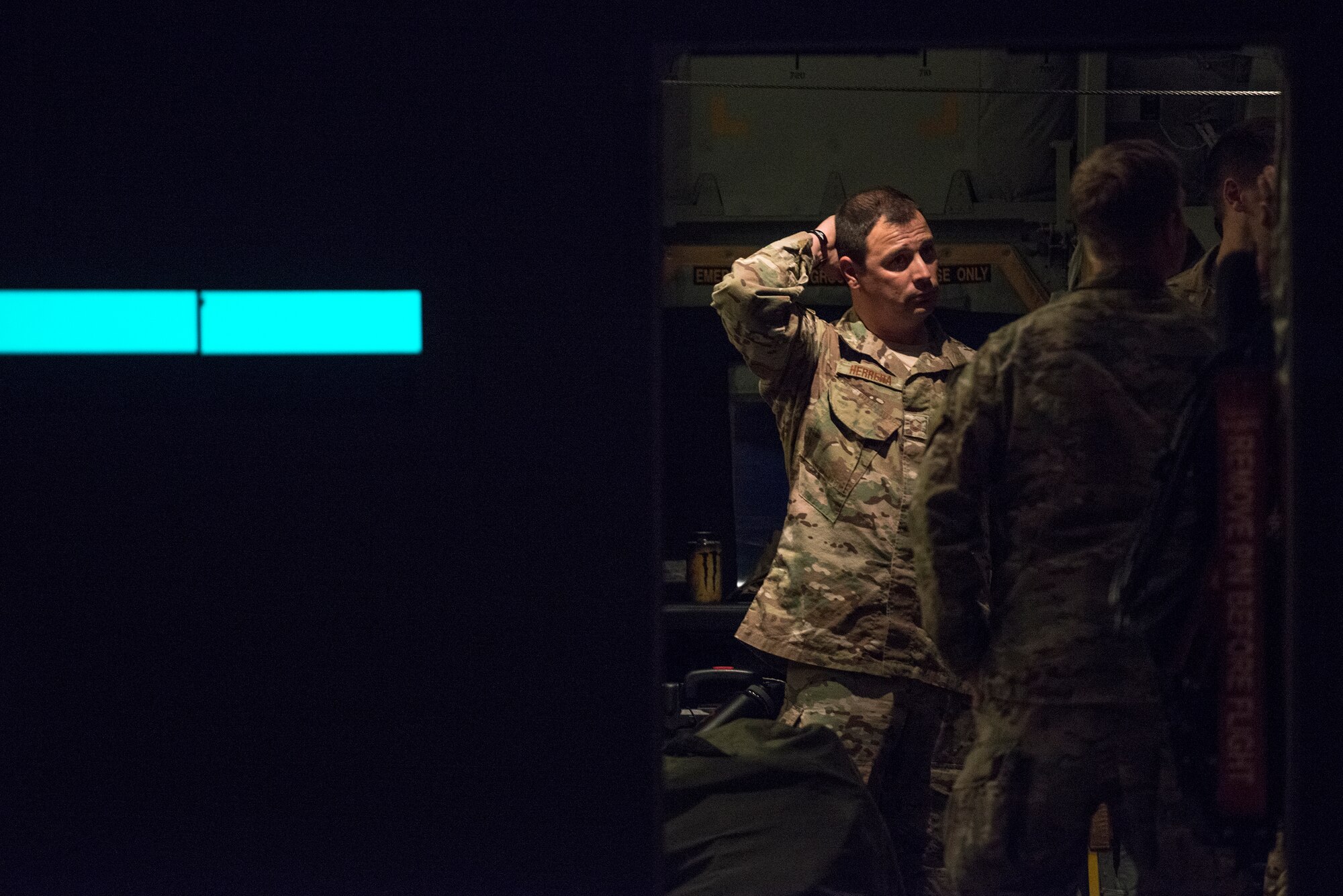 U.S. Air Force Master Sgt. Michael Herrera, 347th Rescue Group, speaks with other passengers prior to deploying in support of Operation Inherent Resolve, Nov. 27, 2015, at Moody Air Force Base, Ga. The deployed Airmen from Moody’s RQG are working to ensure U.S. personnel do not become isolated. (U.S. Air Force photo by Senior Airman Ryan Callaghan/Released)

