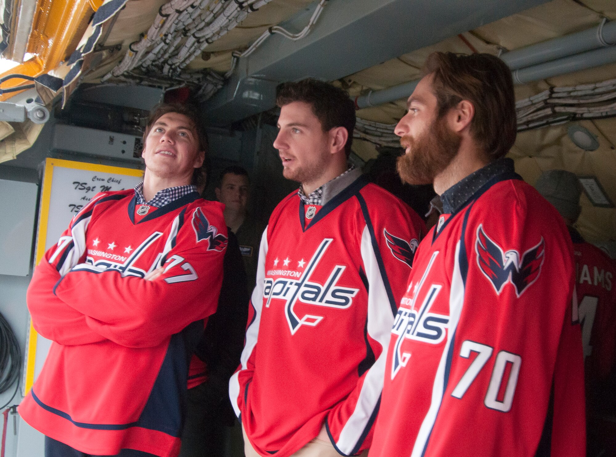 A group of Washington Capitals players hang out inside the cargo hold of a 459th Air Refueling Wing KC-135R Stratotanker during a team tour at Joint Base Andrews, Md., Dec. 1, 2015. The Capitals observed special performances by the U.S. Air Force band Max Impact, Honor Guard, 11th Wing Explosive Ordnance Disposal, as well as static displays from the 1st Helicopter Squadron and 113th Wing, Air National Guard. (U.S. Air Force photo by Staff. Sgt. Kat Justen)