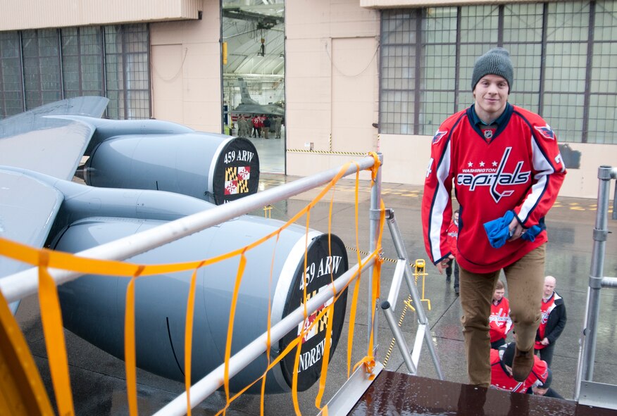 John Carlson, Washington Capitals defenseman, embarks on a 459th Air Refueling Wing KC-135R Stratotanker during a team tour at Joint Base Andrews, Md., Dec. 1, 2015. The Capitals observed special performances by the U.S. Air Force band Max Impact, Honor Guard, 11th Wing Explosive Ordnance Disposal, as well as static displays from the 1st Helicopter Squadron and 113th Wing, Air National Guard. (U.S. Air Force photo by Staff. Sgt. Kat Justen)