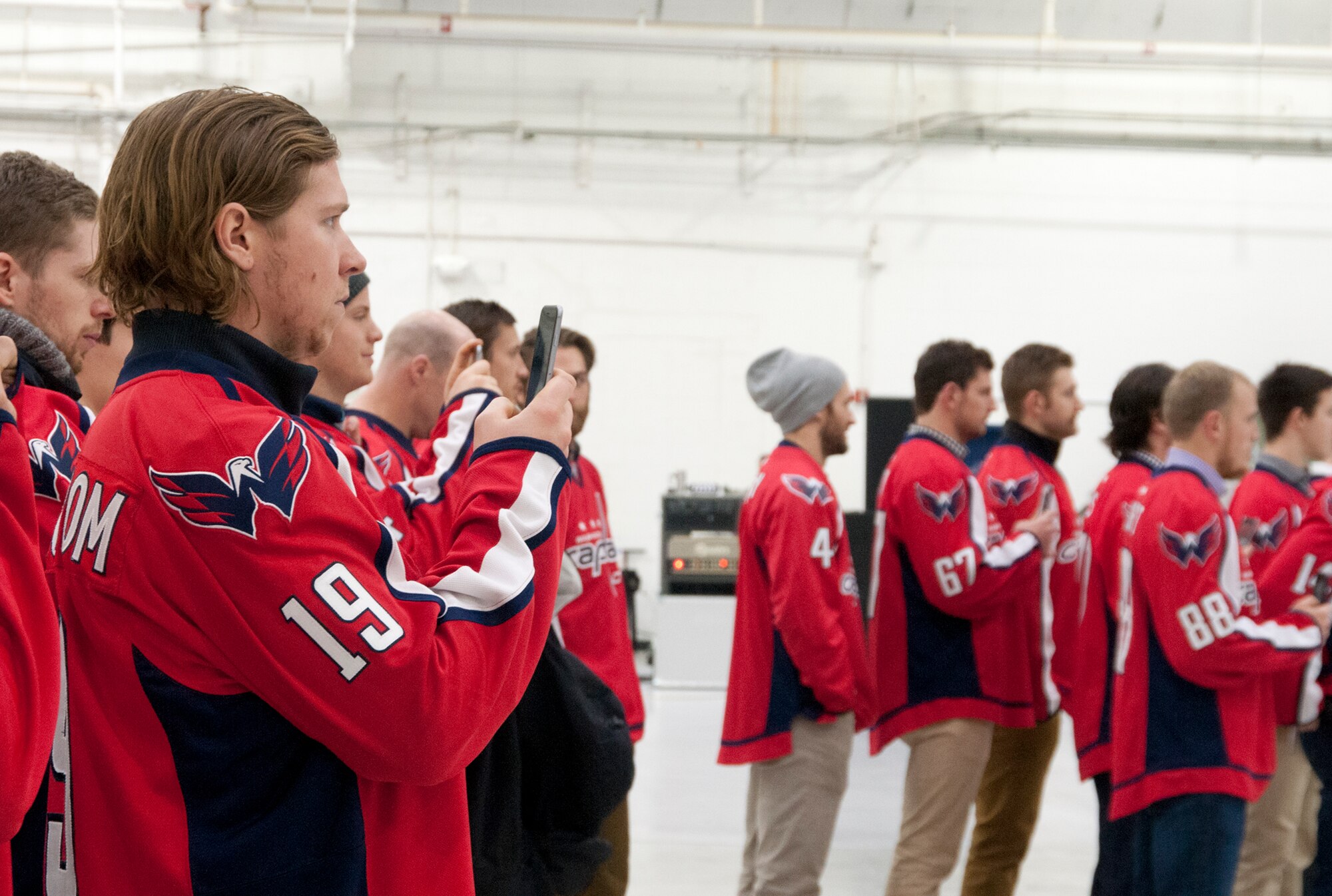 Michael Latta, Washington Capitals center forward (left), and Braden Holtby, Capitals goalie (right), share a laugh inside the cockpit of a 459th Air Refueling Wing KC-135R Stratotanker during a team tour at Joint Base Andrews, Md., Dec. 1, 2015. The Capitals observed special performances by the U.S. Air Force band Max Impact, Honor Guard, 11th Wing Explosive Ordnance Disposal, as well as static displays from the 1st Helicopter Squadron and 113th Wing, Air National Guard. (U.S. Air Force photo by Staff. Sgt. Kat Justen)