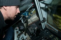 Matt Niskanen, Washington Capitals defenseman, observes the control panel for the refueling boom inside the boom pod of a 459th Air Refueling Wing KC-135R Stratotanker on the Joint Base Andrews, Md., flight line Dec. 1, 2015.  The Capitals visited JBA to learn about the Air Force mission here. They observed special performances by the U.S. Air Force band Max Impact, Honor Guard, 11th Wing Explosive Ordnance Disposal, as well as static displays from the 459 ARW, 1st Helicopter Squadron and 113th Wing, Air National Guard. (U.S. Air Force photo by Staff. Sgt. Kat Justen)