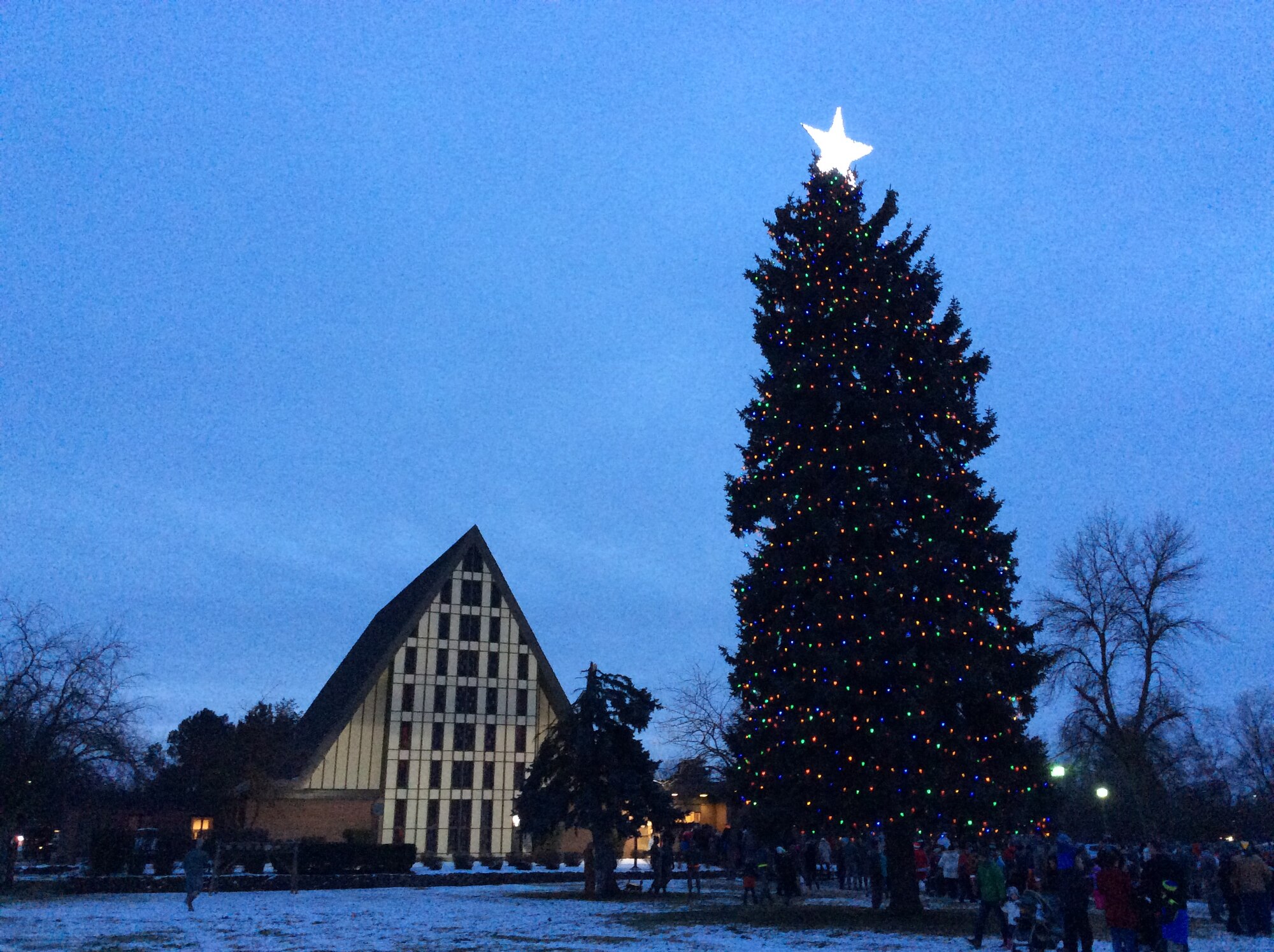 Members of Team Fairchild attend a tree lighting ceremony Dec, 1, 2015 in front of the base chapel, at Fairchild Air Force Base, Wash. The ceremony marks the start of the holiday season and included a visit from Santa. (U.S. Air Force photo/Airman 1st Class Mackenzie Richardson)