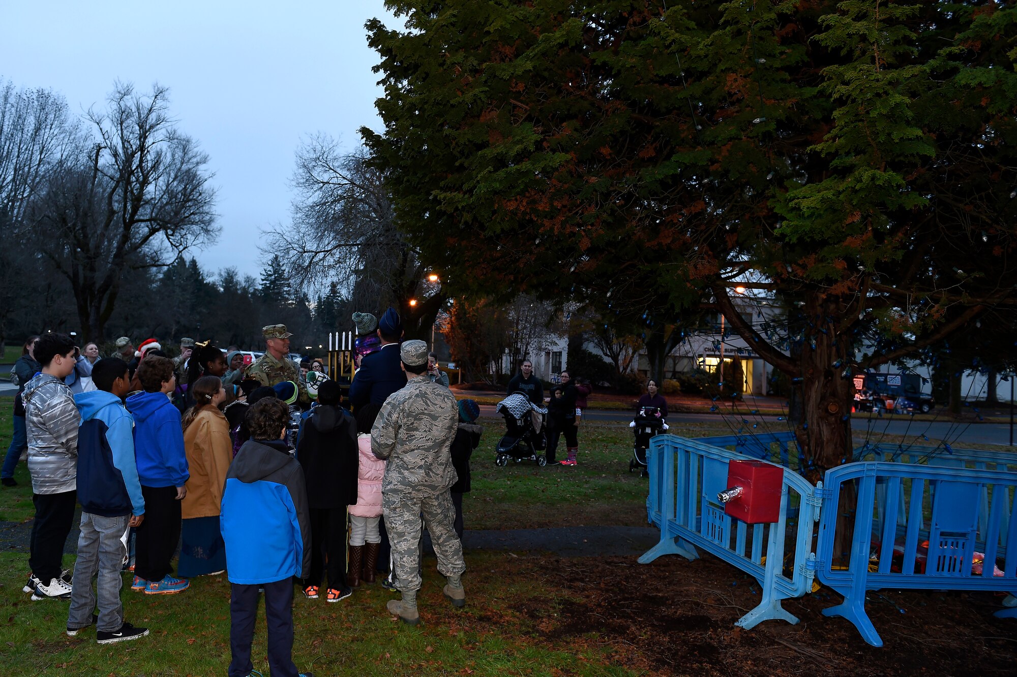 JBLM leadership and children “light” the Menorah during McChord Field Annual Holiday Lighting Ceremony Dec. 2, 2015 at Joint Base Lewis-McChord, Wash. Along with the Menorah a Christmas tree was “lit” during the ceremony. (U.S. Air Force photo by Tech. Sgt. Tim Chacon)