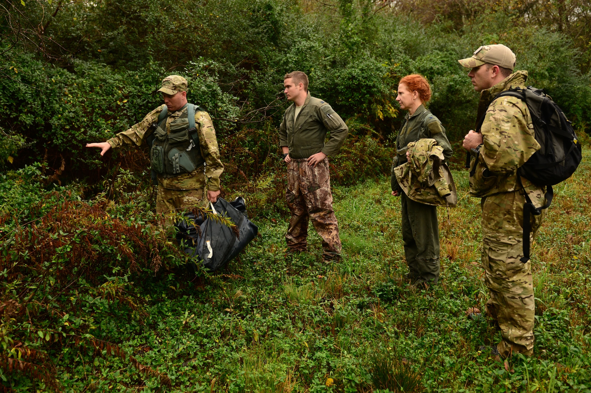 U.S. Air Force Tech. Sgt. Sean Hanson, a survival, evasion, resistance and escape specialist assigned to the 1st Operations Support Squadron, discusses hiding gear at Langley Air Force Base, Va., Nov. 19, 2015. Hiding unneeded gear from enemies can help further the distance between the enemy and survivalist. (U.S. Air Force photo by Airman 1st Class Derek Seifert)