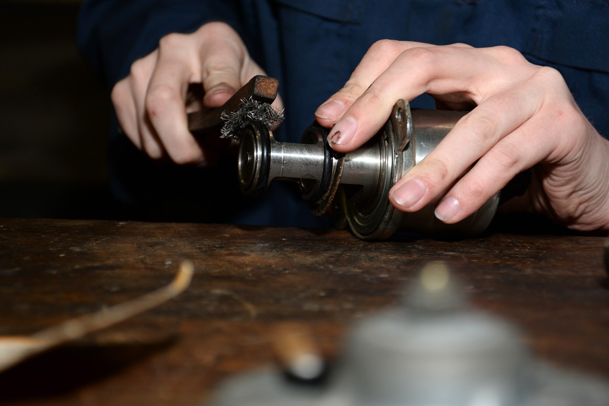 U.S. Air Force Airman 1st Class Carly Reuter, 100th Logistics Readiness Squadron vehicle maintenance journeyman, cleans the exhaust gas recirculation valve for a government vehicle Nov. 24, 2015, on RAF Mildenhall, England. The vehicle is assigned to the 100th Maintenance Squadron Aerospace Ground Equipment section for movement of vital aircraft servicing equipment. Having a team at work through the night enables them to carry out larger, more complex projects without being disturbed by day-to-day tasks. (U.S. Air Force photo by Gina Randall/Released)