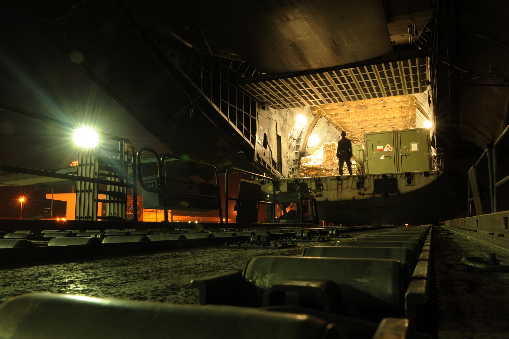 Airman Chase Robinson, 728th Air Mobility Squadron air transportation apprentice, prepares to unload a C-5M Super Galaxy Nov. 12, 2015, at Incirlik Air Base, Turkey.  Airmen from the 728th Air Mobility Squadron receive and processes all of the U.S. Air Force’s personnel, cargo and combat equipment sent to Incirlik AB in support of Operation Inherent Resolve. (U.S Air Force photo by Airman 1st Class Daniel Lile/Released)
