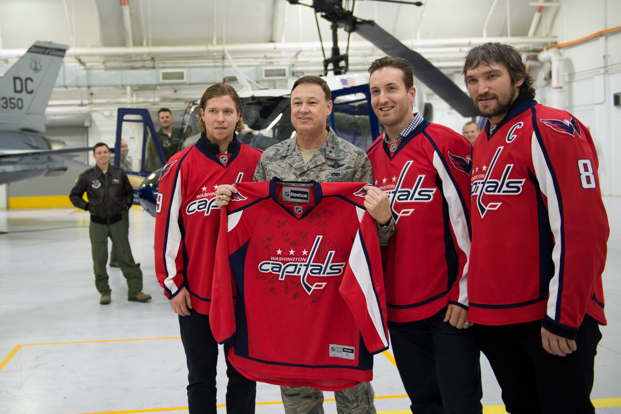 Air Force District of Washington Commander Maj. Gen. Darryl Burke welcomed
members of the Washington Capitals during the team's tour of Joint Base
Andrews Dec. 1, 2015. The visit included performances by Max Impact and the
Air Force Honor Guard, aircraft tours, team-building activities, a
demonstration by the Security Forces military working dogs, and lunch at the
Joint Base Andrews Dining Facility
