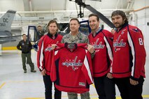 Air Force District of Washington Commander Maj. Gen. Darryl Burke welcomed
members of the Washington Capitals during the team's tour of Joint Base
Andrews Dec. 1, 2015. The visit included performances by Max Impact and the
Air Force Honor Guard, aircraft tours, team-building activities, a
demonstration by the Security Forces military working dogs, and lunch at the
Joint Base Andrews Dining Facility
