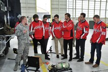 Senior Airman Drew Tesar, Explosive Ordnance Disposal (EOD) Technician, 11th Wing Civil Engineer Squadron, talks about the United States Air Force EOD mission with the Washington Capitals players during the team’s tour of Joint Base Andrews Dec. 1, 2015. The visit included performances by Max Impact and the Air Force Honor Guard, aircraft tours, team-building activities, a demonstration by the Security Forces military working dogs, and lunch at the Joint Base Andrews Dining Facility. (U.S. Air Force photo/James E. Lotz)