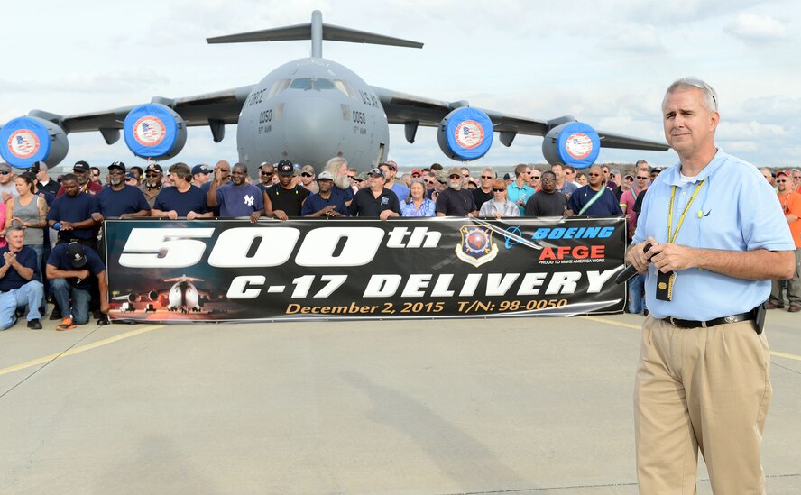Mike Doubleday, 562nd Aircraft Maintenance Squadron director, joins fellow squadron members Dec. 1 during a special celebration on the Robins Flight line to mark the 500th C-17 Globemaster III scheduled to depart the base. The Robins workforce celebrated another milestone earlier this year when the C-17 fleet reached 3 million flying hours. There are 550 personnel in the 562nd AMXS at Robins, which maintains the C-17. (U.S. Air Force photo by Tommie Horton)