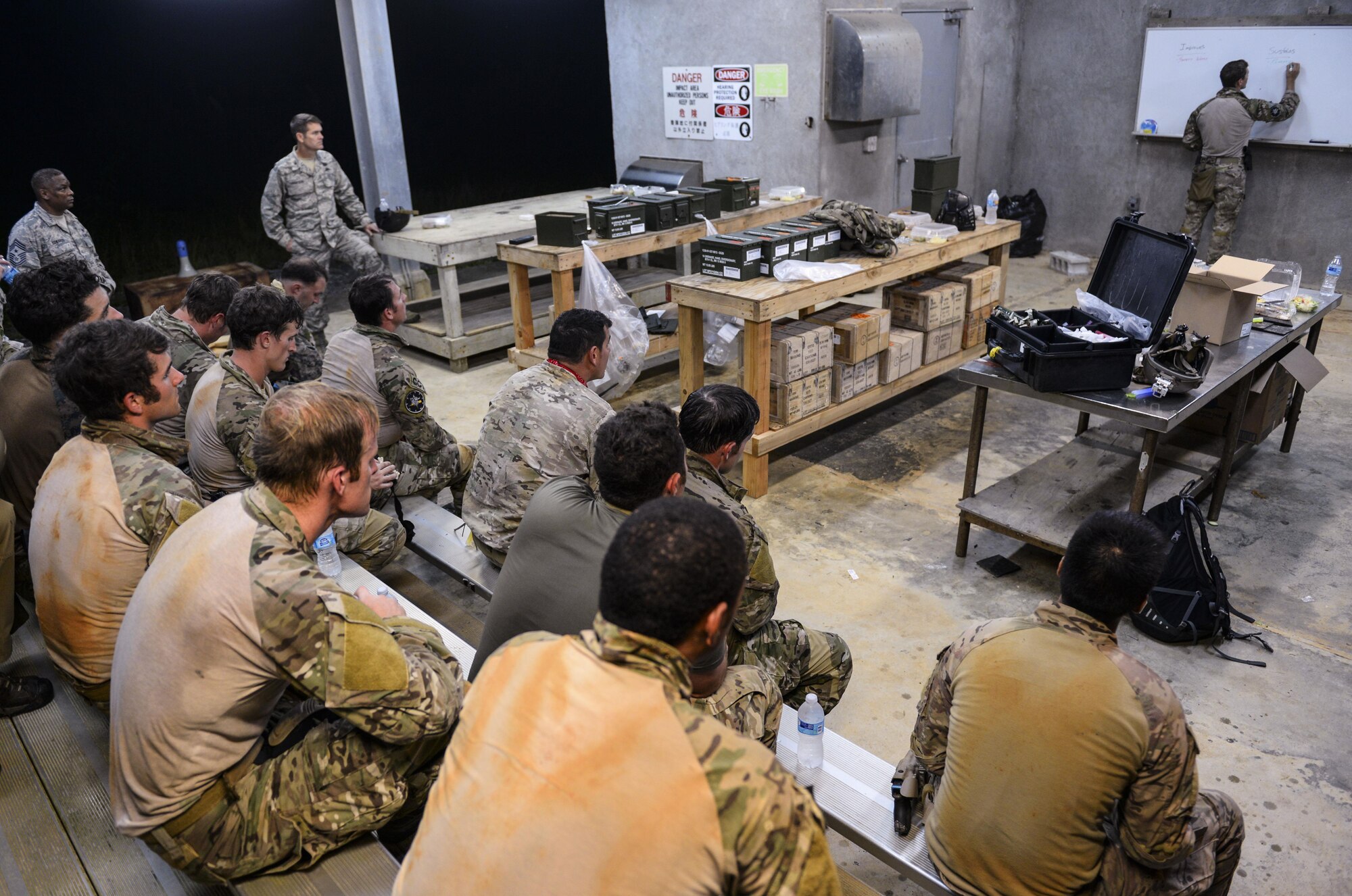 Airmen from the 320th Special Tactics Squadron conduct an after-action briefing Nov. 19, 2015, at Camp Hansen, Japan. The training was held locally in order to reduce the costs that were once used to send entire STS teams overseas. (U.S. Air Force photo by John Linzmeier)