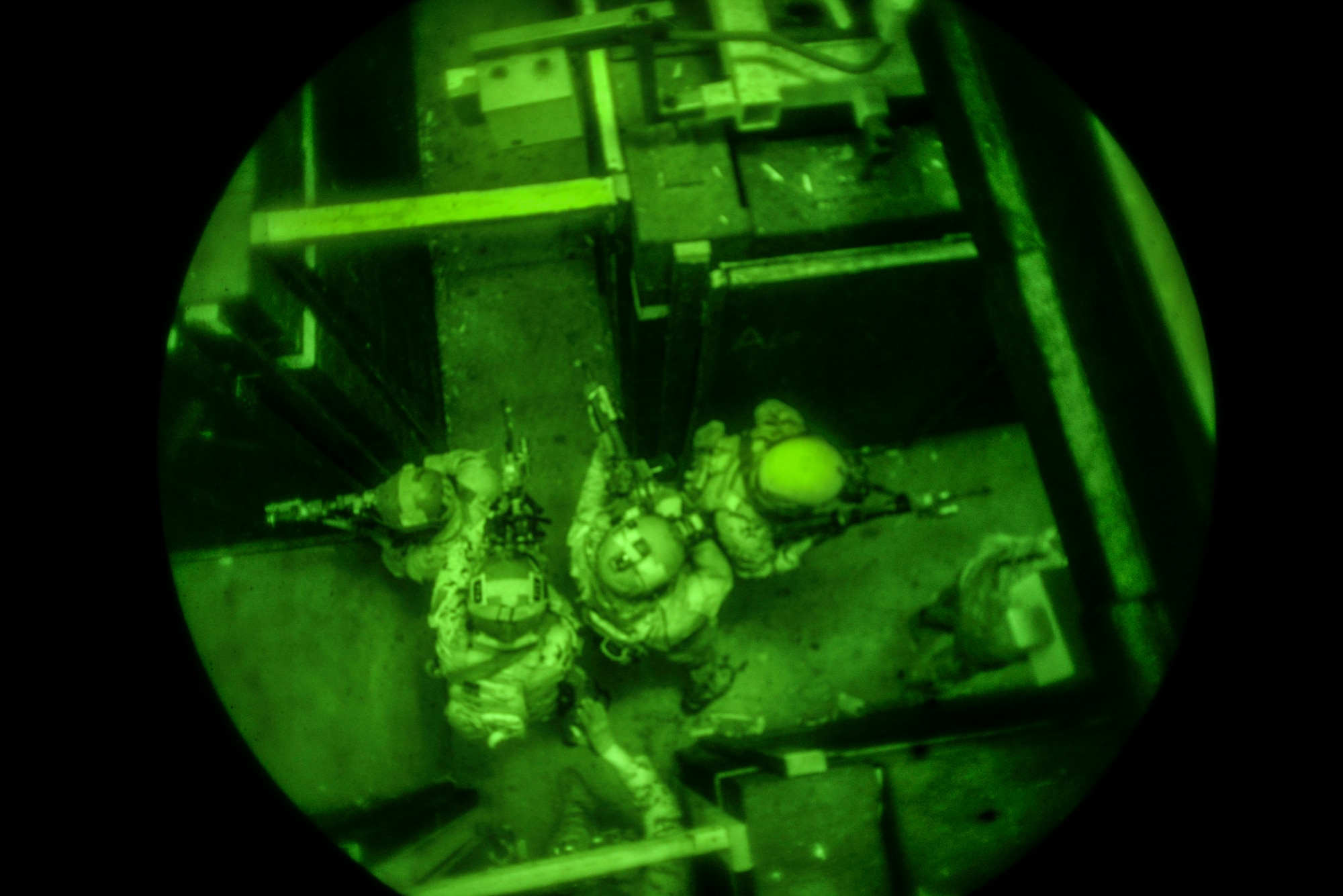 Airmen from the 320th Special Tactics Squadron infiltrate and secure a section of a shoot house Nov. 19, 2015, at Camp Hansen, Japan. The Airmen participated in a two-week training course that enhanced teamwork skills, enabling members to quickly adapt to a new special operations team if needed for mission requirements. (U.S. Air Force photo by John Linzmeier)