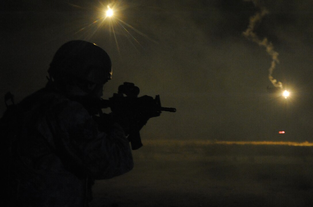 A Field Craft - Contingency Response proof of concept student fires during night-fire training on Nov. 6, 2015, at Joint Base McGuire-Dix-Lakehurst, New Jersey. The 14-day training course was designed to improve how Contingency Response Airmen are trained in air base opening combat skills. (U.S. Air Force photo/Tech. Sgt. Chris Powell)