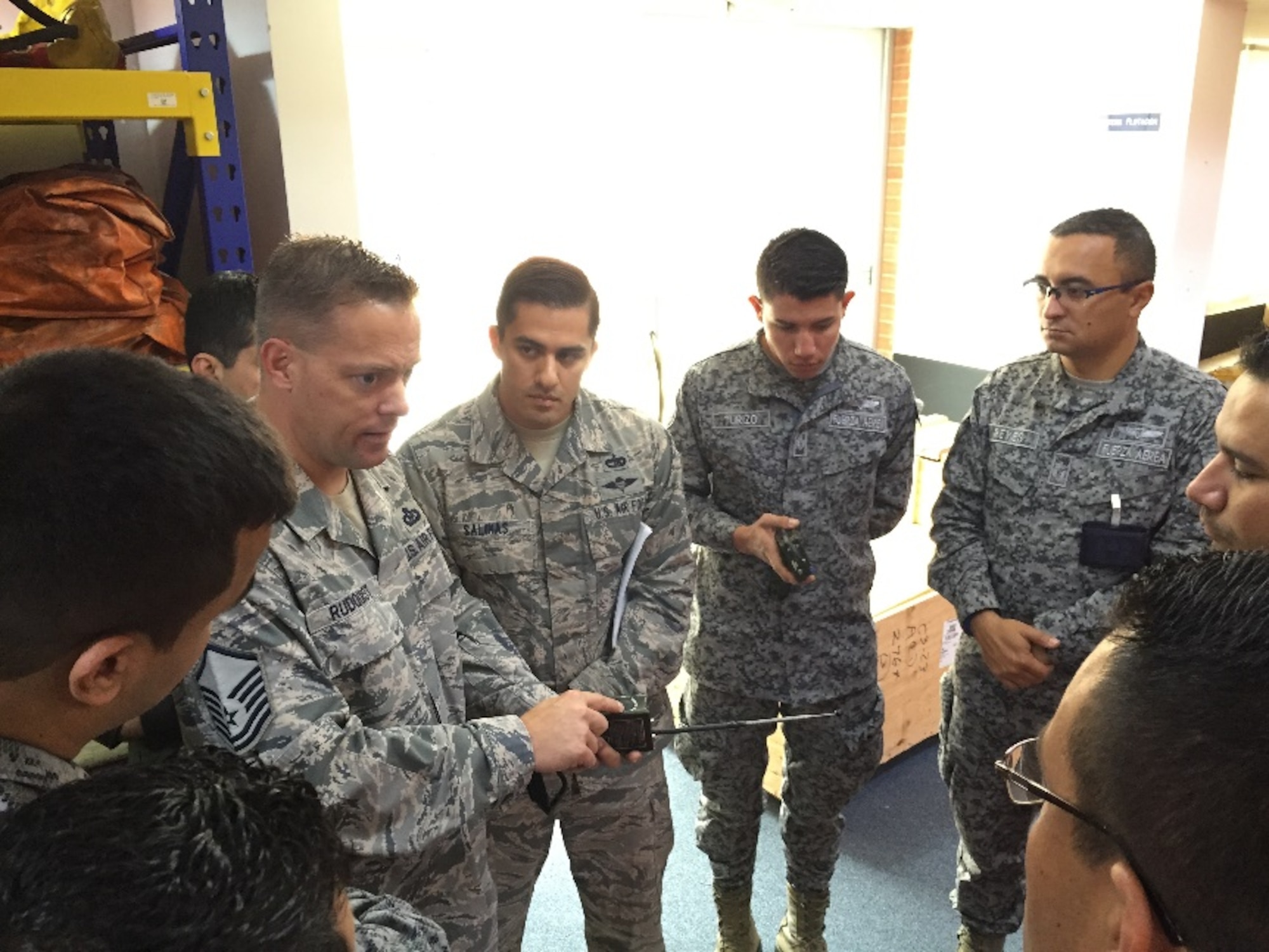 Master Sgt. Bryan Rudquist, 571st Mobility Support Advisory Squadron air advisor stationed at Travis Air Force Base, Calif., instructs members of the Colombian Air Force on aircrew survival equipment during a building partner capacity operation at the Comando Aereo de Transporte Militar in Bogata, Colombia. (Courtesy photo)