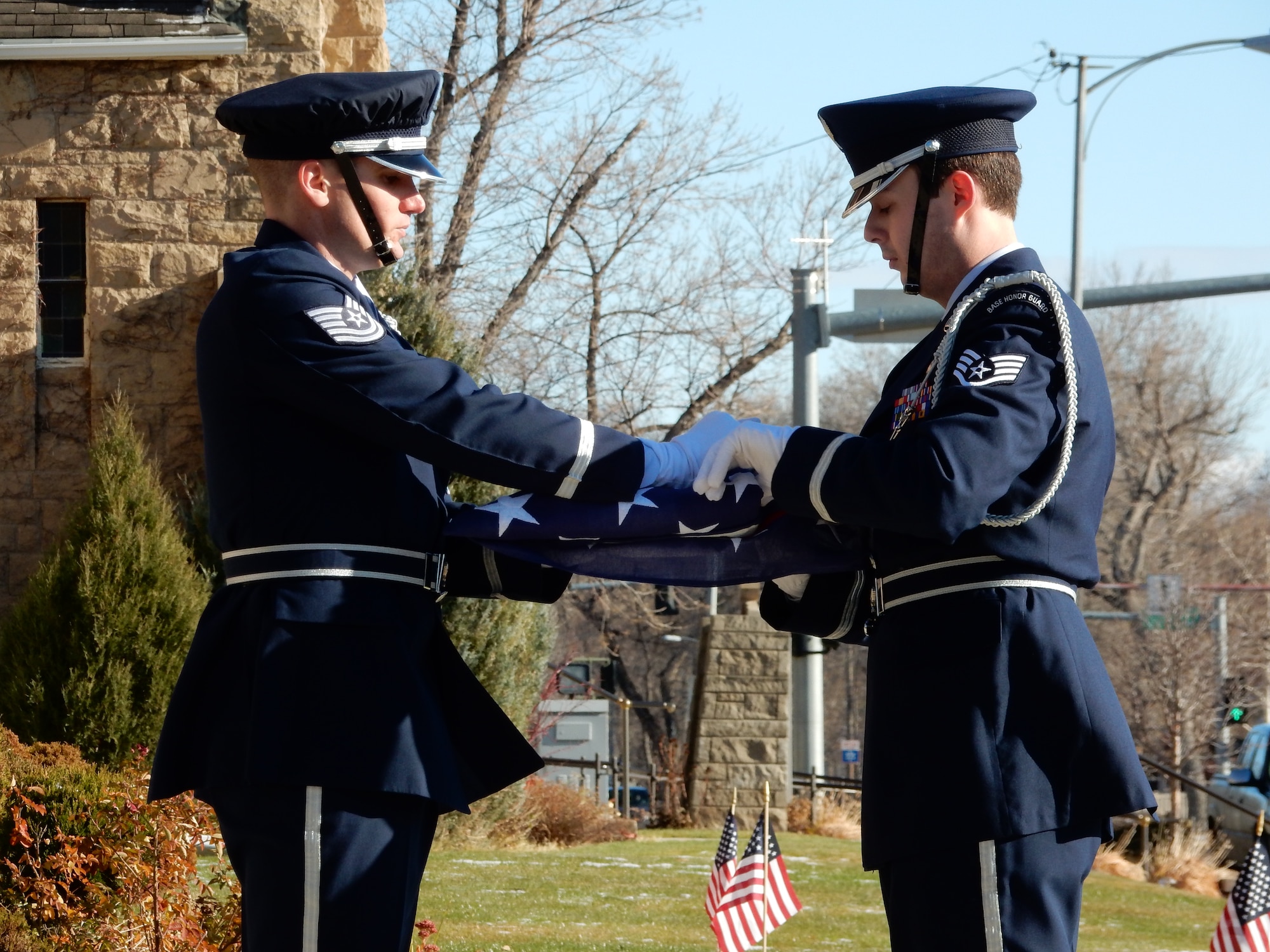 120th Airlift Wing Base Honor Guard members Tech. Sgt. Quinn Nelson and Staff Sgt. Trevor Livingston practice folding a flag prior to performing military funeral honors Nov. 19, 2015. (U.S. Air National Guard photo by Senior Master Sgt. Eric Peterson/Released)
