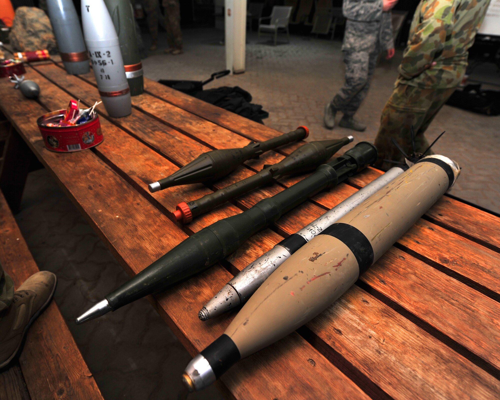 Explosive ordinance disposal Airmen with the 380th Expeditionary Civil Engineer Squadron display explosive and improvised explosive device examples during an EOD Capabilities Carnival at an undisclosed location in Southwest Asia, Nov. 27, 2015. Primary activities of EOD Airmen include detecting, rendering safe or destroying explosive devices, improvised explosive devices and weapons of mass destruction. (U.S. Air Force photo by Staff Sgt. Kentavist P. Brackin/Released)