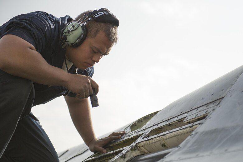 Tech. Sgt. Carlo Patalinghug, 455th Expeditionary Aircraft Maintenance Squadron crew chief, deployed Hill Air Force Base, Utah, examines an F-16 Fighting Falcon to isolate and repair a hydraulic leak at Bagram Airfield, Afghanistan, Nov. 30, 2015.  The squadron provides combat-ready aircraft to the air component commander in support of coalition forces throughout Afghanistan. (U.S. Air Force Photo by Tech. Sgt. Robert Cloys/Released)