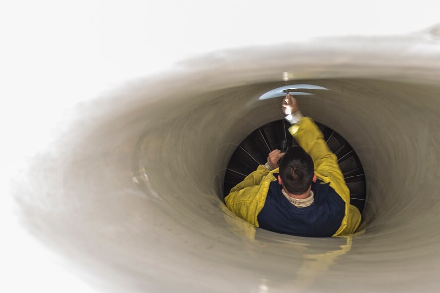 Staff Sgt. Steven Benton, 455th Expeditionary Aircraft Maintenance Squadron crew chief, deployed Hill Air Force Base, Utah, performs an intake inspection on an F-16 Fighting Falcon at Bagram Airfield, Afghanistan, Nov. 30, 2015. The squadron provides combat-ready aircraft to the air component commander in support of coalition forces throughout Afghanistan. (U.S. Air Force Photo by Tech. Sgt. Robert Cloys/Released)