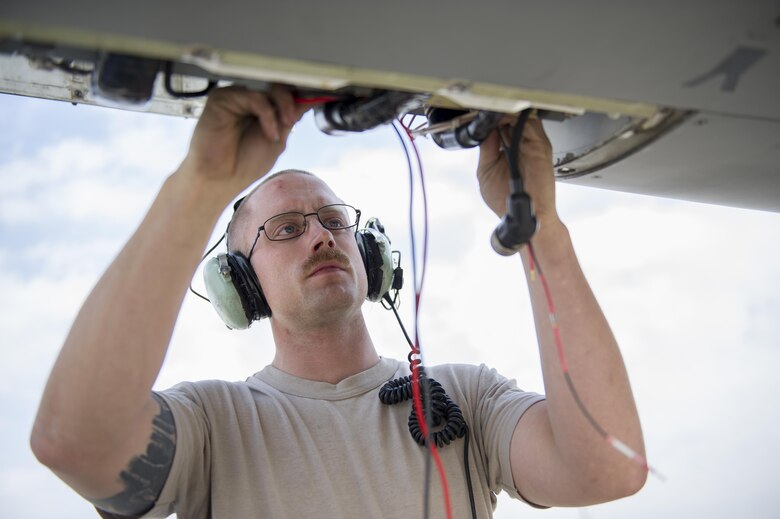Staff Sgt. Brendan Lee, 455th Expeditionary Aircraft Maintenance Squadron avionics technician, deployed from Hill Air Force Base, Utah, troubleshoots a faulty radar module on an F-16 Fighting Falcon at Bagram Airfield, Afghanistan, Nov. 30, 2015. The squadron provides combat-ready aircraft to the air component commander in support of coalition forces throughout Afghanistan. (U.S. Air Force Photo by Tech. Sgt. Robert Cloys/Released)