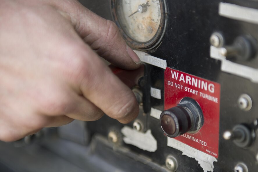 Staff Sgt. Brendan Lee, 455th Expeditionary Aircraft Maintenance Squadron avionics technician, powers on a generator before troubleshooting a faulty radar module on an F-16 Fighting Falcon at Bagram Airfield, Afghanistan, Nov. 30, 2015. The squadron provides combat-ready aircraft to the air component commander in support of coalition forces throughout Afghanistan. (U.S. Air Force Photo by Tech. Sgt. Robert Cloys/Released)
