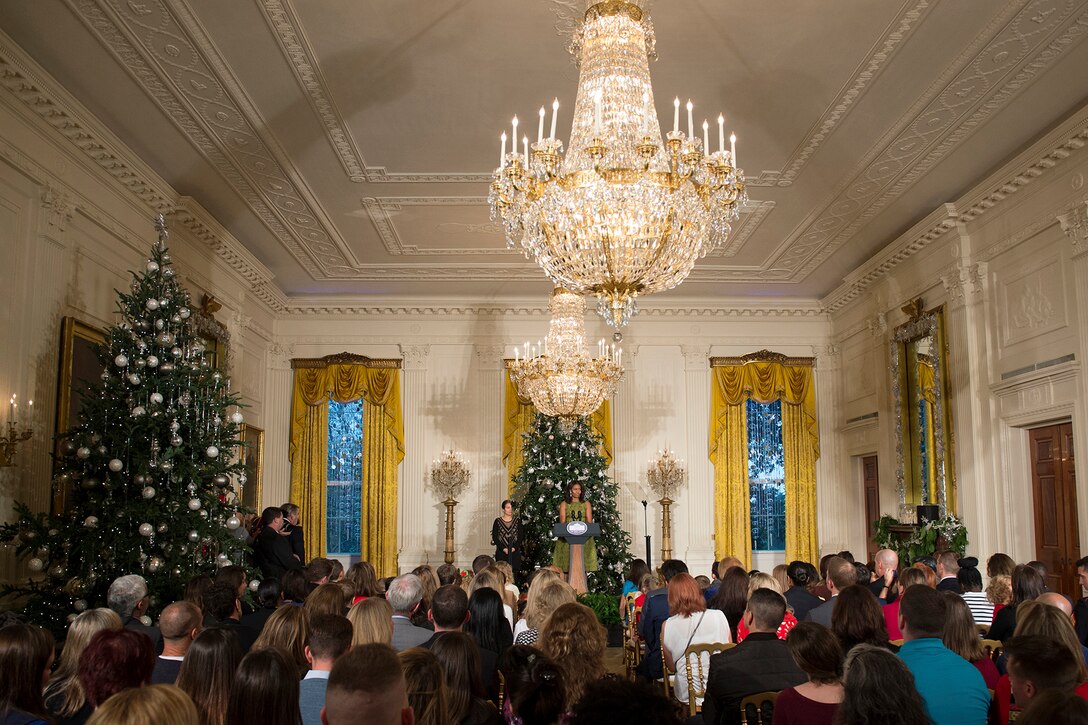 First Lady Michelle Obama welcomes military families to an event honoring all military families at the White House in Washington, D.C., Dec. 2, 2015. The event gave the families a first look at the White House's holiday decorations. DoD photo by EJ Hersom