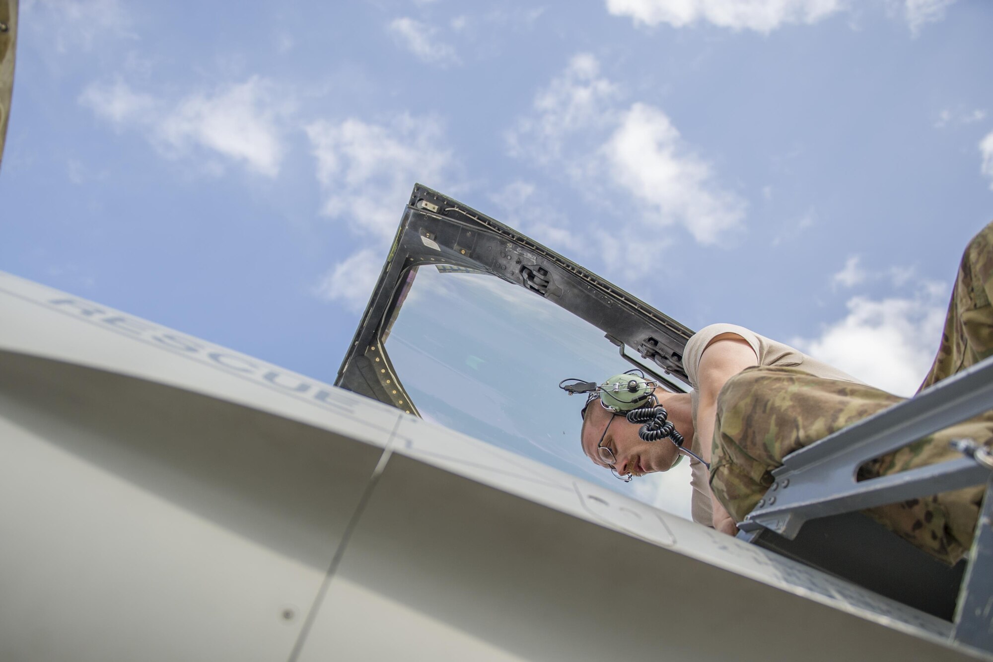 Staff Sgt. Brendan Lee, 455th Expeditionary Aircraft Maintenance Squadron avionics technician, deployed from Hill Air Force Base, Utah, climbs to the cockpit of an F-16 Fighting Falcon to troubleshoot a faulty radar module at Bagram Airfield, Afghanistan, Nov. 30, 2015. The squadron provides combat-ready aircraft to the air component commander in support of coalition forces throughout Afghanistan. (U.S. Air Force Photo by Tech. Sgt. Robert Cloys/Released)
