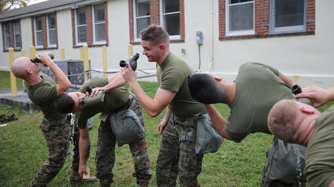 Marines with 2nd Transport Support Battalion practice rinsing their eyes during chemical, biological, radioactive and nuclear defense training held at Marine Corps Base Camp Lejeune, N.C., Dec. 1, 2015. Marines applied information obtained in classes about an active chemical threat and the proper protective equipment to decontaminate themselves in a CBRN situation.