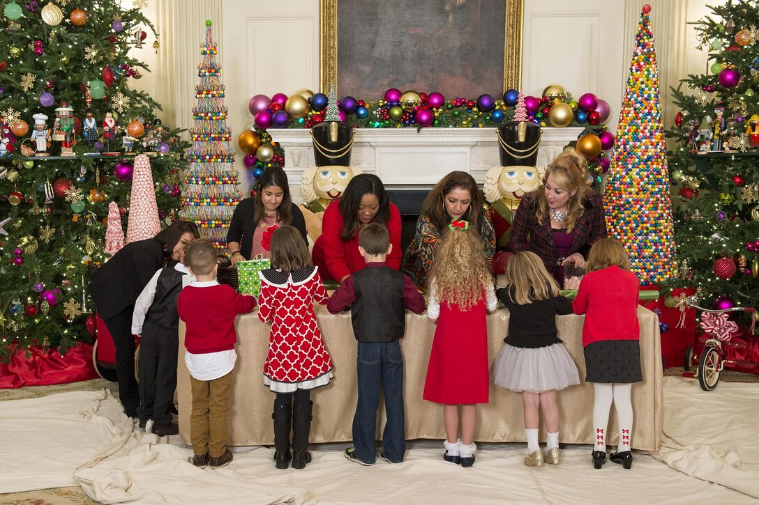 Military families make treats during a holiday event honoring all military families at the White House in Washington, D.C., Dec. 2, 2015. DoD photo by EJ Hersom