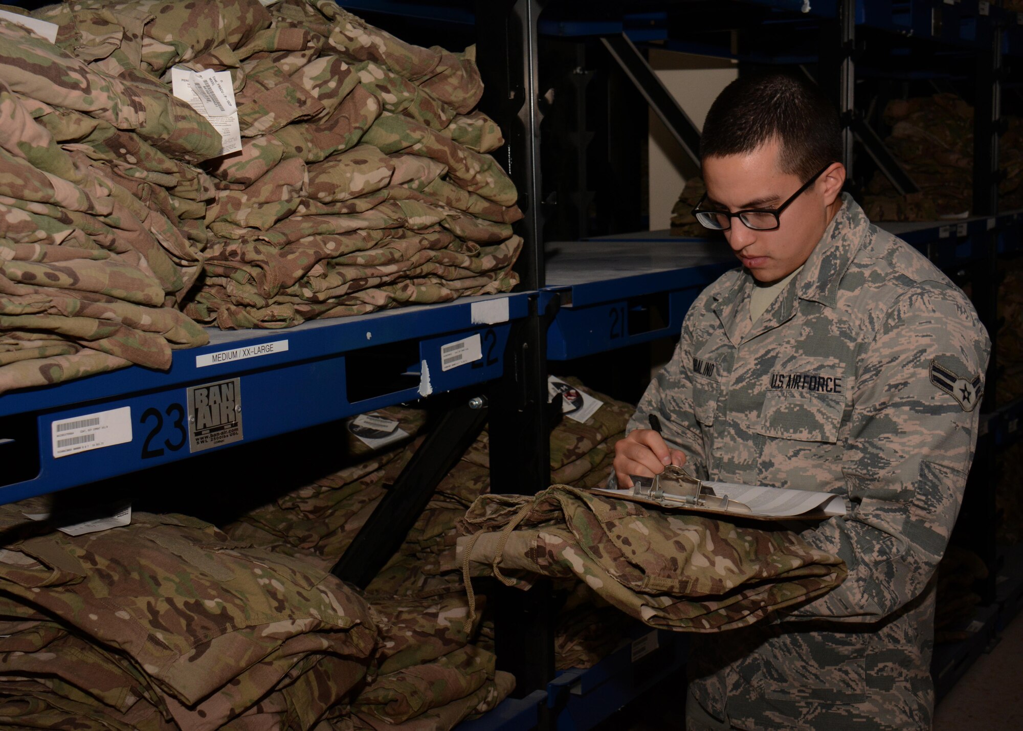 Airman 1st Class Juan Robalino, 379th Expeditionary Logistics Readiness Squadron Desert Depot journeyman, inventories uniforms at Al Udeid Air Base, Qatar Dec. 3. Robalino, a native of Quito, Ecuador, said it’s important to track items properly so accountability is maintained. Since July 2015 the Desert Depot has issued more than 146,000 items valued at $1.4 Million. (U.S. Air Force photo by Tech. Sgt. James Hodgman/Released)