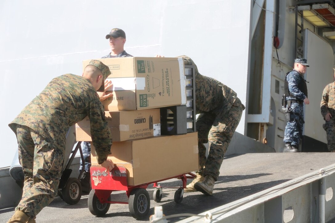 NAVAL BASE SAN DIEGO, California (Dec. 2, 2015) – U.S. Marines and Sailors with the Boxer Amphibious Ready Group and the 13th Marine Expeditionary Unit began loading up on ship for their Certification Exercise, the final stepping stone before deployment into the Pacific and Central areas of operation, Dec. 2, 2015. CERTEX will test the unit's ability to complete each of its mission essential tasks and determine if the unit is prepared to deploy. (U.S. Marine Corps photo by Sgt. Paris Capers/Released)