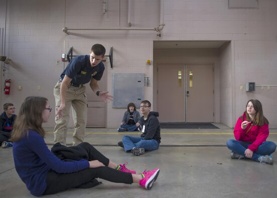Senior Airman Chance Pettey, a member of the National Air and Space Intelligence Center, speaks with Young Marines participating in the Community Emergency Response Team exercise Oct. 17, 2015 at the Huber Heights Fire Department. Pettey is a volunteer for the fire department as a community educator on the community outreach team. (U.S. Air Force Photo by Senior Airman Justyn M. Freeman)